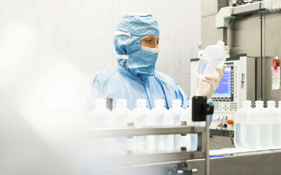 A man working in a lab looking at chemicals