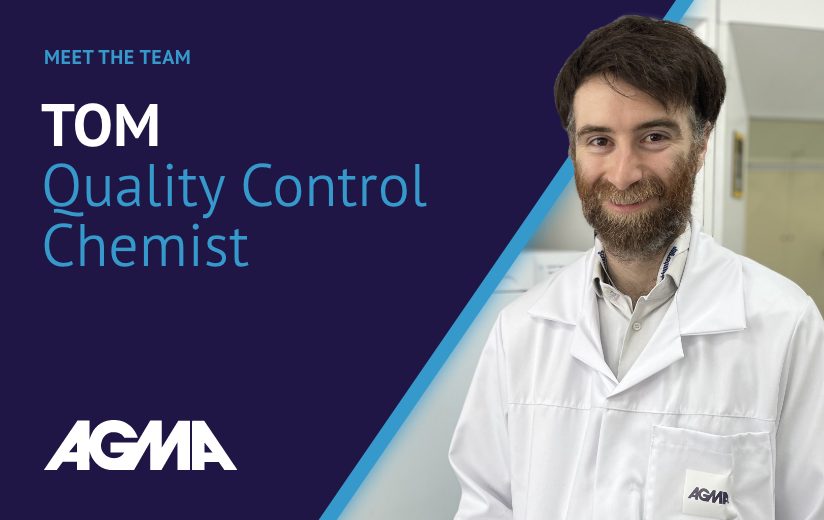 A man with a beard in a lab coat